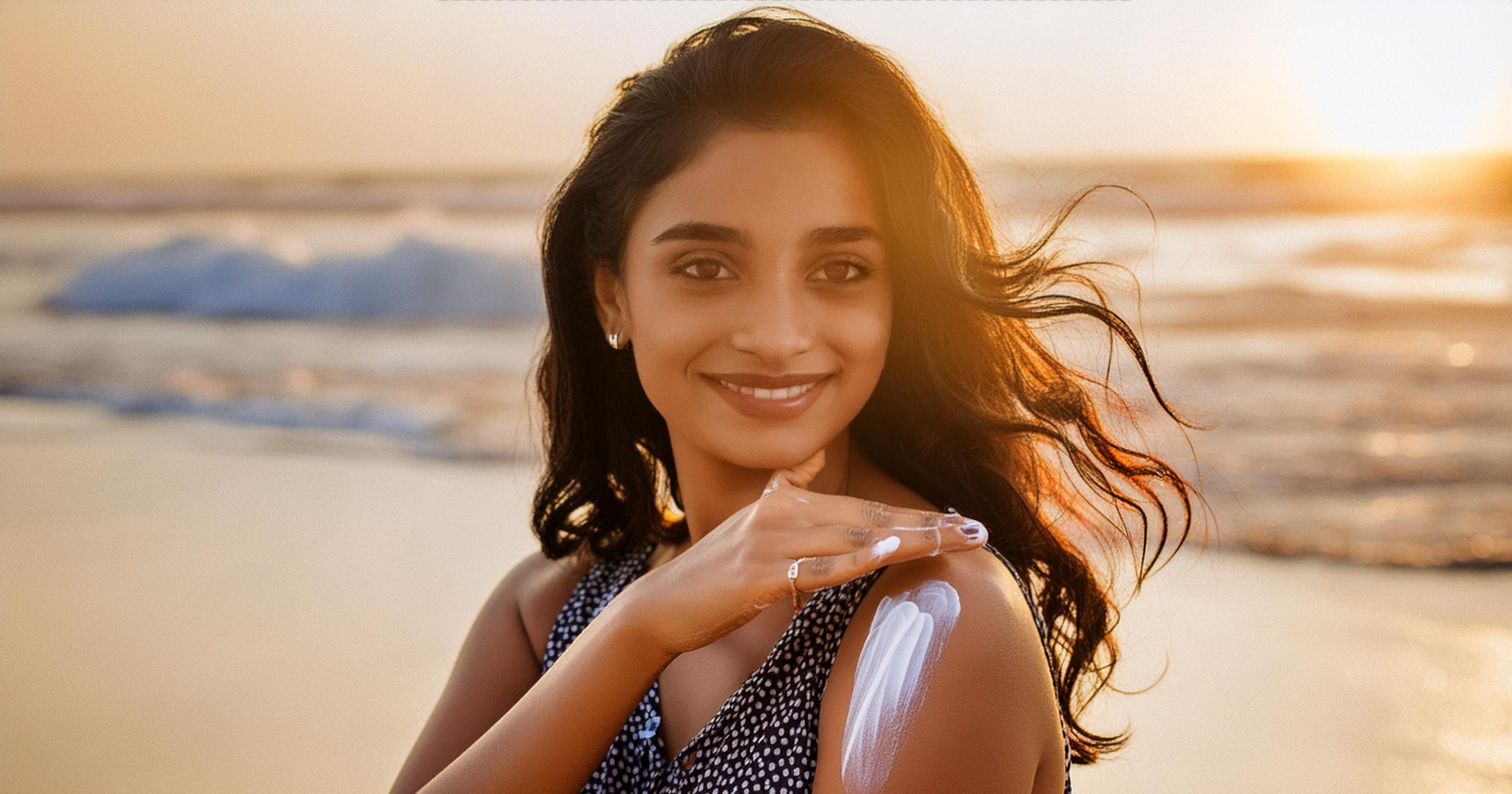 Women applying sunscreen image